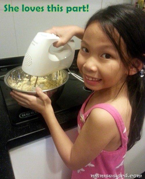 Child mix butter and sugar
